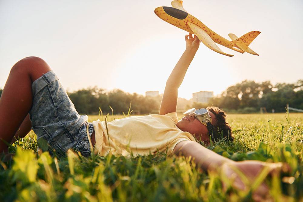 Boy playing in a field