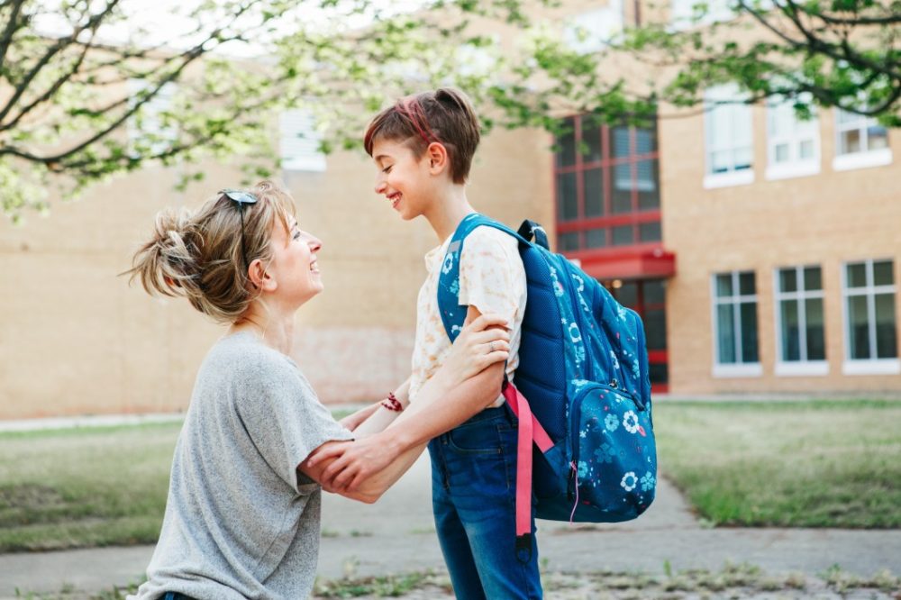 Mom talking to daughter before school