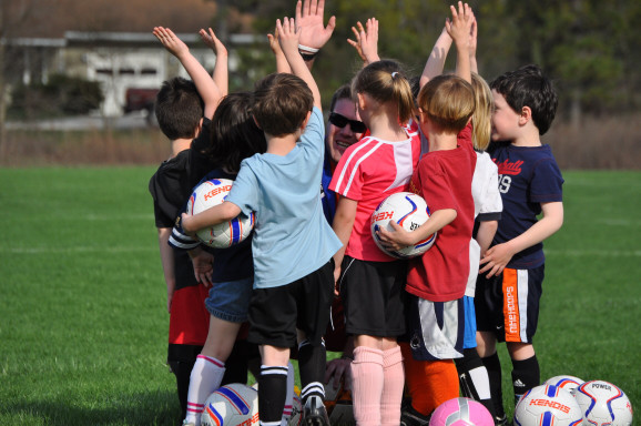 Kids playing soccer in youth program